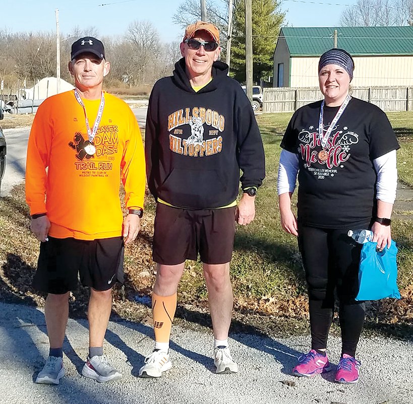 Kurt Hoehn, left, was the overall winner and winner of the adult division at the third annual First Noelle 5K on Saturday, Dec. 5, in Nokomis. Randy Rieke and Rosie McDonald would finish second and third in the adult division of the race, which honored the life of the late Ayden O’Malley.